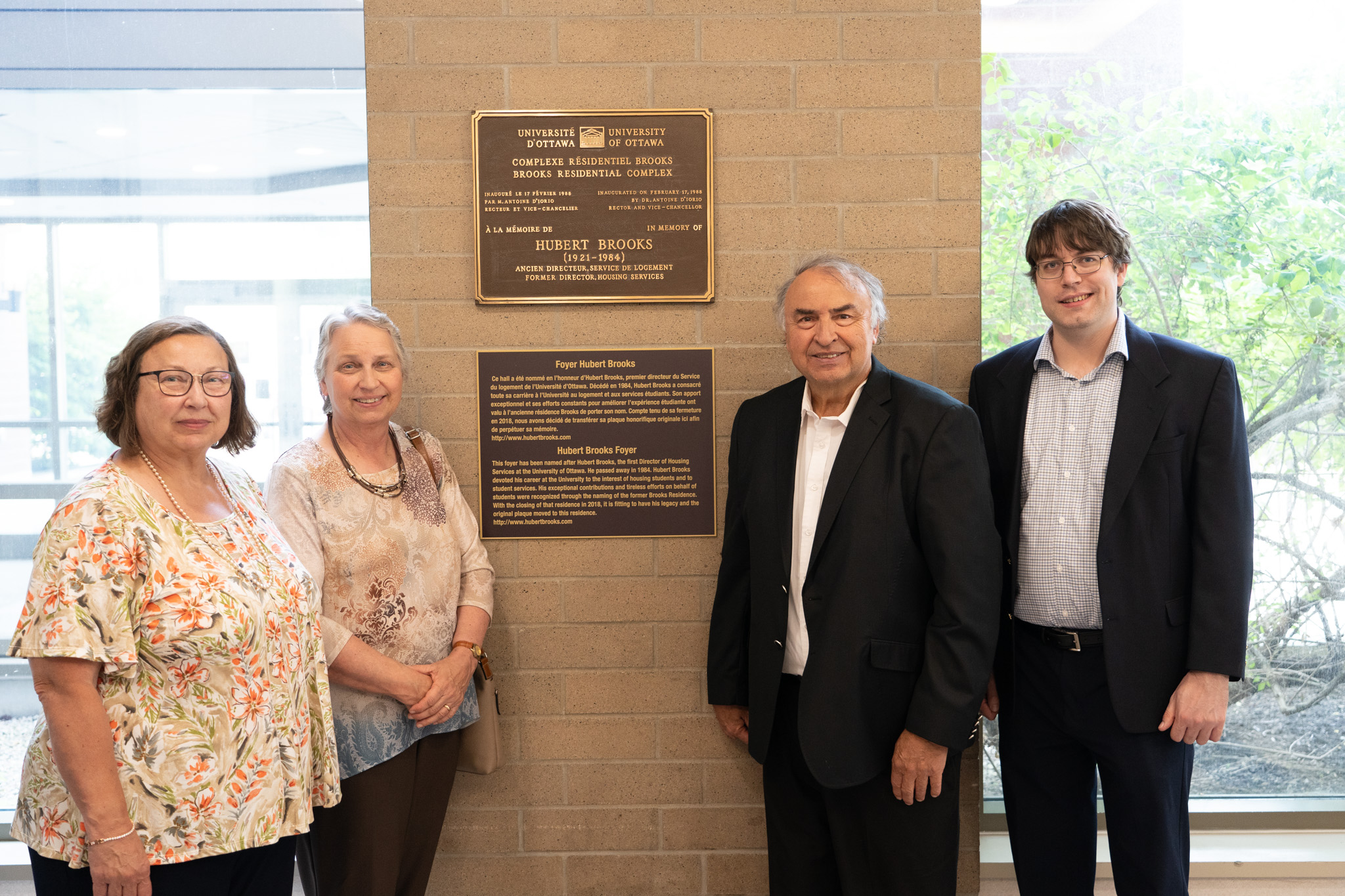 Photo: Brooks Family  Photo in front of Plaque for Hubert Brooks Foyer
