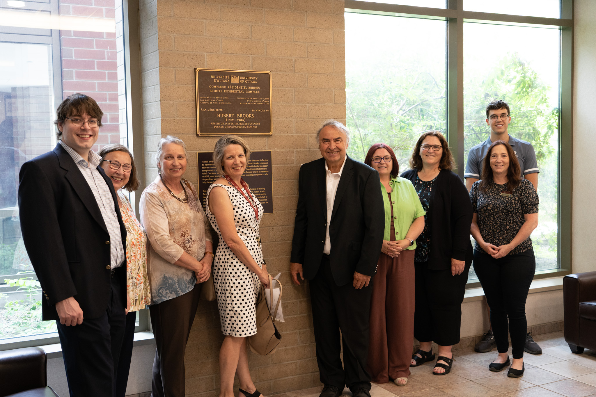 Photo: Group Photo in front of Plaque for Hubert Brooks Foyer