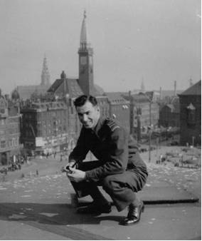 PHOTO: Hubert Brooks in Copenhagen Kneeling in Front of Town Square