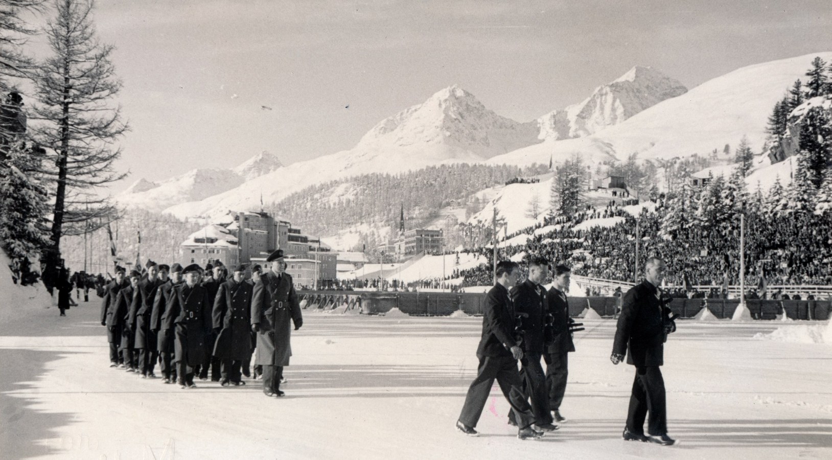 Photo: R.C.A.F. Flyers Hockey Team  March into Stad Olympique at Opening Ceremonies 1948 Winter Olympics
